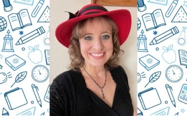 Teacher wearing a red hat
