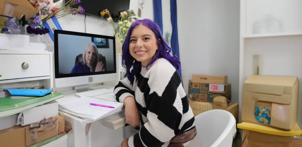 girl smiling studying at home